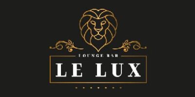 Logo du lounge bar "Le Lux" avec une tête de lion dorée sur fond noir.